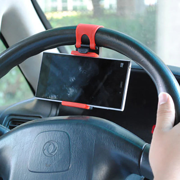 Car steering wheel phone holder for secure hands-free device use.